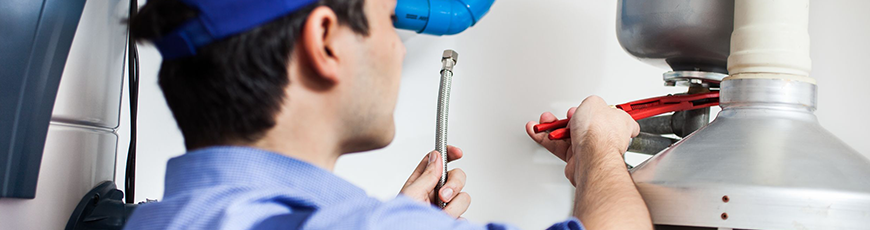 Technician servicing a heating unit
